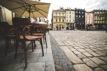 Empty coffee terrace with tables and chairs