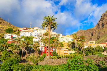 Colorful houses of Gran Valle village in tropical mountain landscape of La Gomera island, Spain