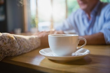 Close-up of coffee cup on table