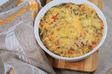 Meat vegetables pie and with cheese on a plate on a gray background