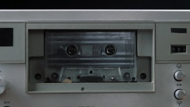 Audio cassette playing. Cassette in cassette player