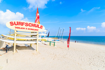 SYLT ISLAND, GERMANY - SEP 6, 2016: Sign of surfing school on sandy List beach, Sylt island,...