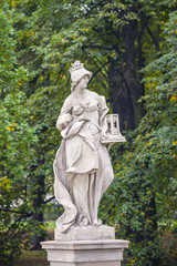 Fototapeta na wymiar Rococo sculptures in the Saxon Garden, Warsaw, Poland