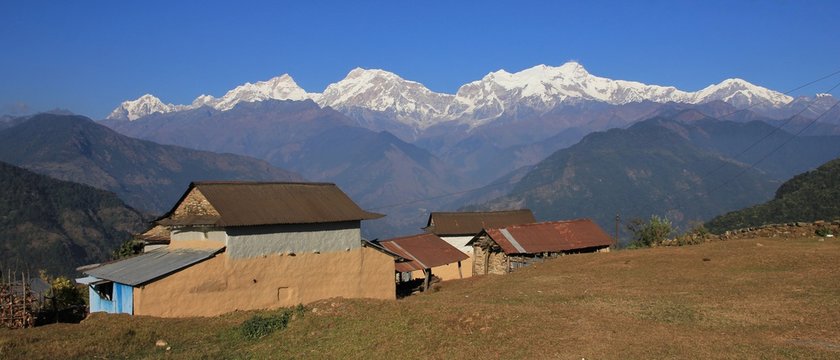 Farmhouses near Ghale Gaun and mountains of the Manaslu range, Nepal.