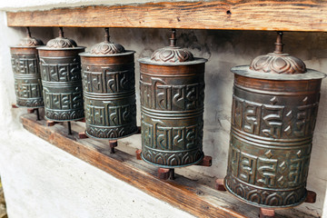 The row of authentic buddhist prayer drums