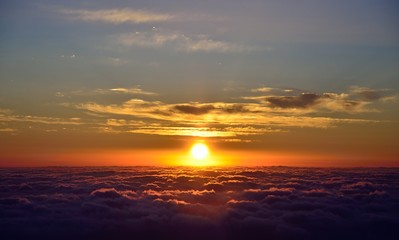 Beautiful sky at sunrise over the sea of clouds