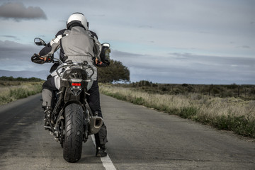 Fototapeta na wymiar Rider on Motorbike ready to ride