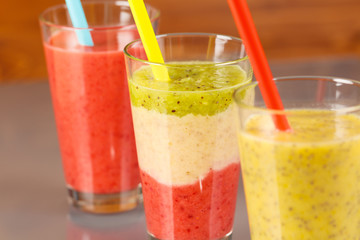 3 different smoothies with straws, low focus,