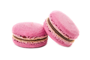 two pink macaron with a taste of raspberries, isolated in a white background