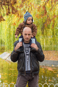 Father carrying son piggyback