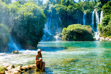 Girl near Kravice Waterfall Bosnia - obrazy, fototapety, plakaty