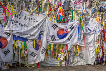 Flags and Buddhist prayer ribbons at the Bridge of Freedom near the Korean demilitarized zone