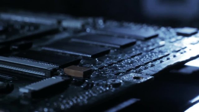 Closeup sliding video of pc motherboard. Repair parts, new technology , recycling, technician and industry support concept.