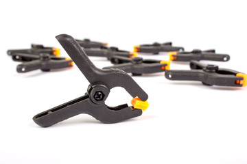 Clothespin. Carpentry clamps. Plastic clothespin on a white background.