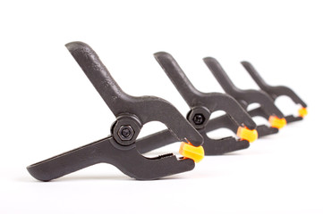 Obraz premium Clothespin. Carpentry clamps. Plastic clothespin on a white background.