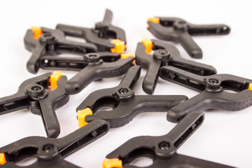 Clothespin. Carpentry clamps. Plastic clothespin on a white background.