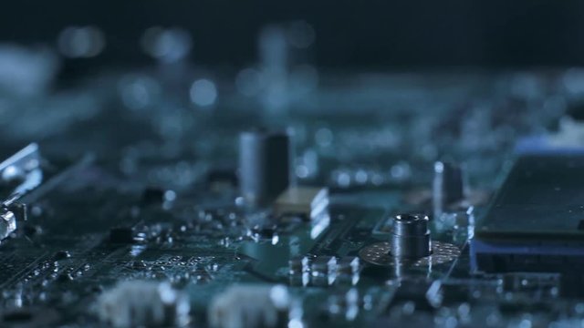 Closeup sliding video of computer motherboard. Repair pc parts, new technology , recycling, technician and industry support concept.