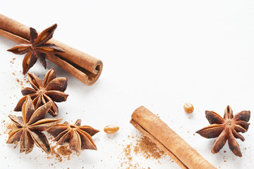 anise star with cinnamon stick background
