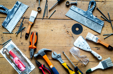 building implements set for repair on wooden background top view