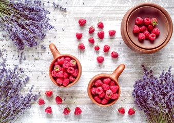 dry laveder bouquet and raspberry on wooden background top view mockup
