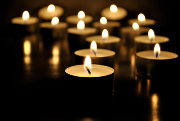 Candles light; candle flame background; selective focus.