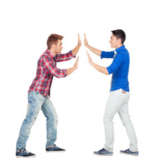 Two guys pushing against
