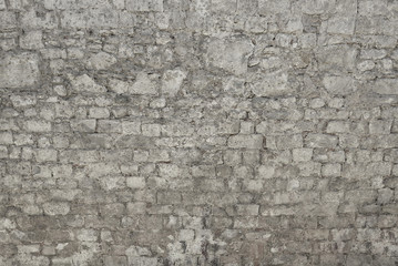 Old grey stone wall background texture