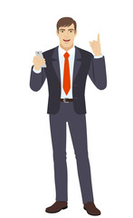Businessman with mobile phone pointing up