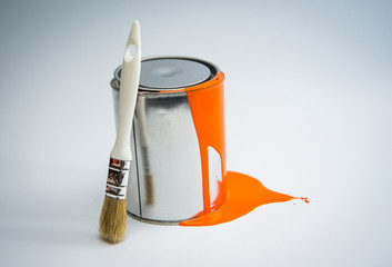 Paint tin can with paint brush