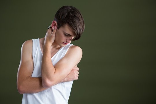 Androgynous Man Embracing Himself