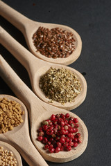 Various of spices in wooden spoons