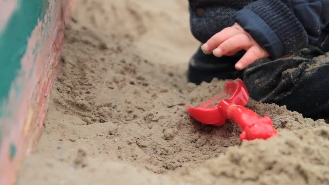 Сhild playing in sandbox