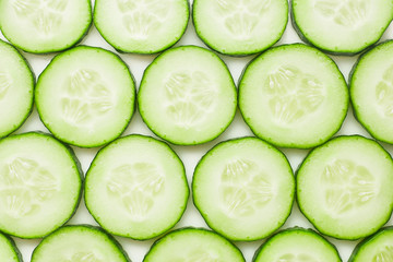 fresh juicy slice cucumber on a white background, isolated