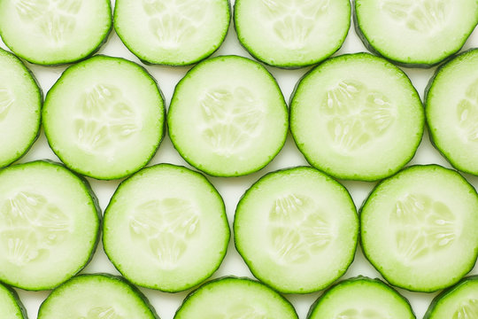 fresh juicy slice cucumber on a white background, isolated