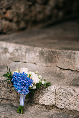 Wedding bouquet on a stone background. Wedding in Montenegro