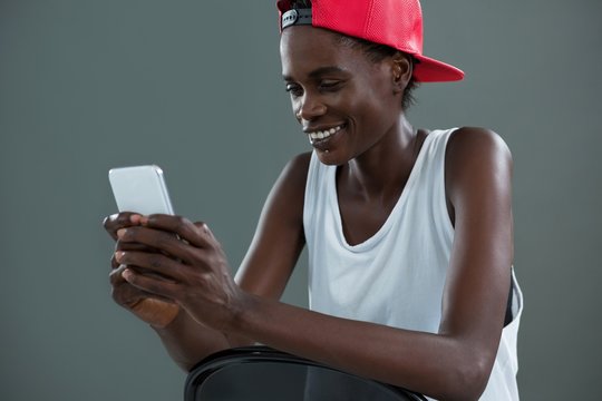 Androgynous Man Using Mobile Phone