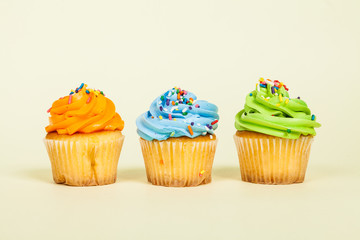 Three tasty  decorated muffins