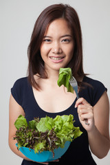 Healthy Asian woman with salad.