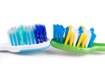 Comparison of toothbrush with  round tip bristle and tapered bristle
