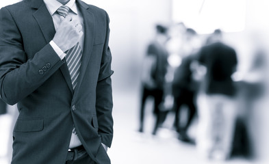 isolated business man on shopping mall background on blue tone