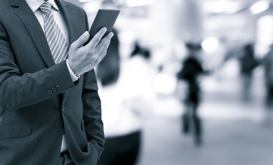 isolated business man on shopping mall background with blue tone