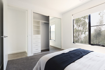 Mirrored wardrobe detail in a bedroom with a view