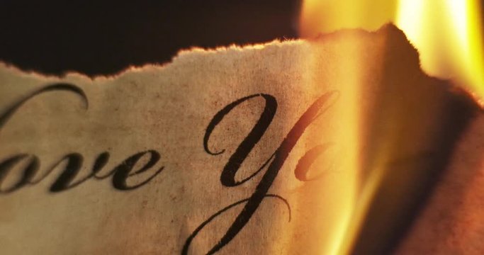 Letter burning in the fire. (I love you!) 4K.
