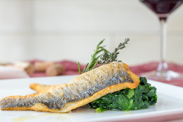 Roasted fillet of sea bass with spinach
