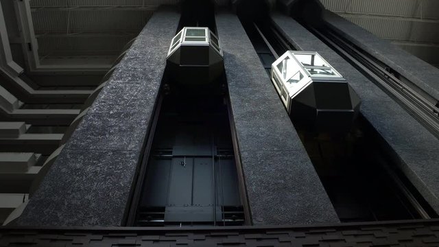 Modern open elevator shaft in the futuristic business center