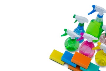 High angle view of spray bottles and cleaning sponge