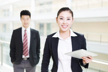 young asian businessman and businesswoman in modern office