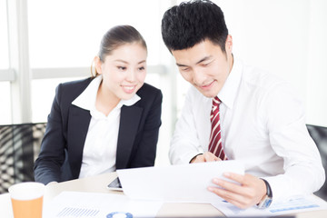 young asian businessman and businesswoman in modern office