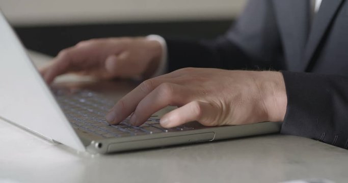Man typing on computer keyboard