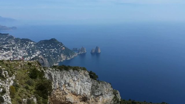 Capri (Naples), Campania area, Italy. Aerial footage of the beautiful and well known Faraglioni. The three spurs of rock which rise up out of the sea in a wonderful day.